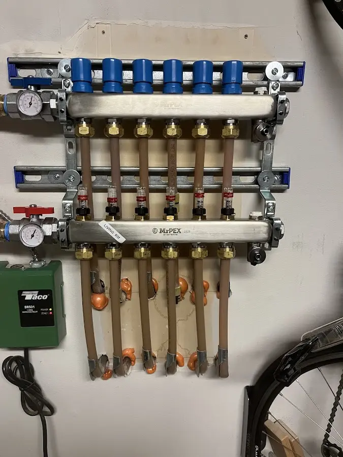 Plumber performing Water Heater Repair at a residential property in West Newbury